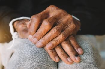 Close up of male wrinkled hands, old man is wearing - Nuttapong punna - stock.adobe.com