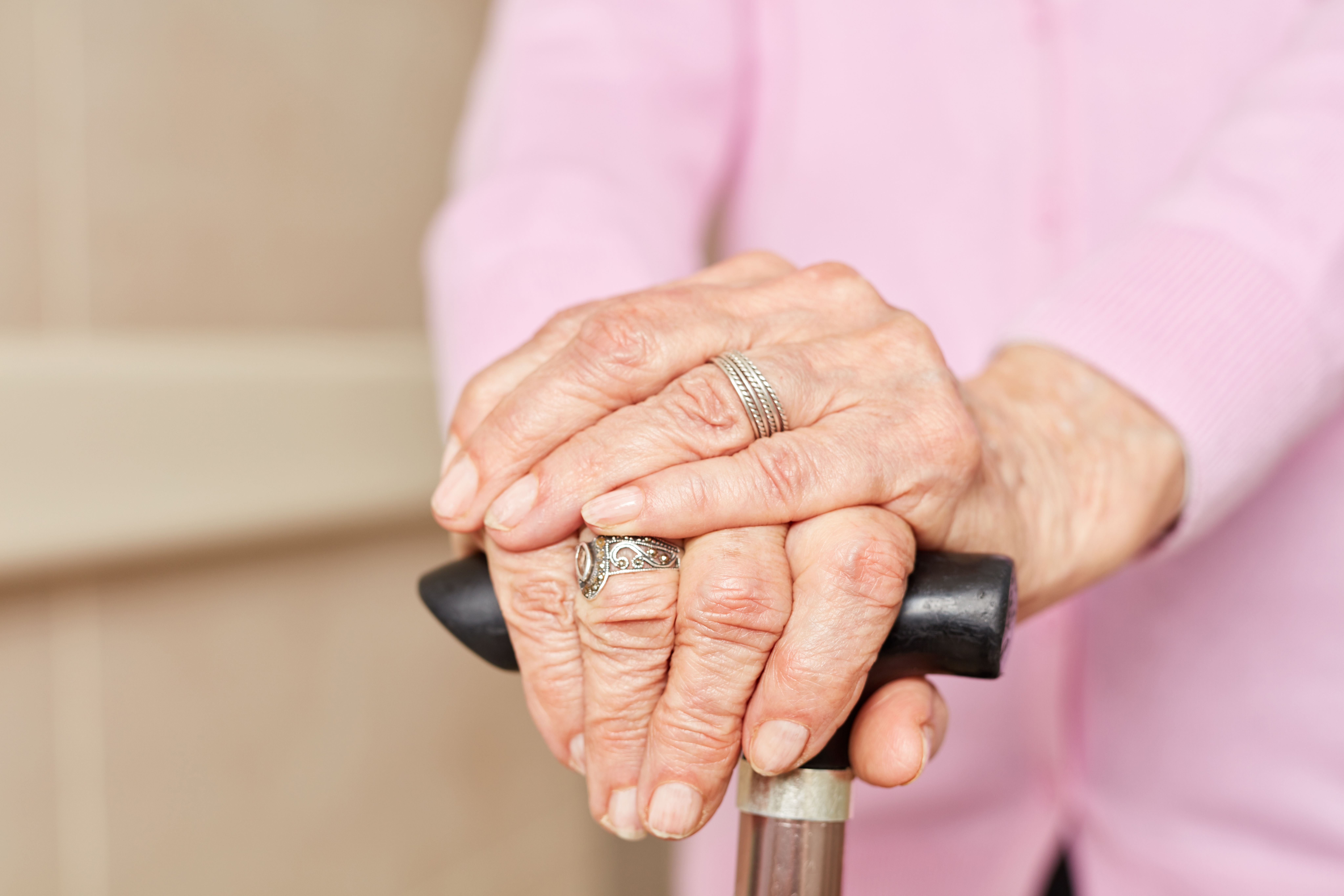 Older woman's hands on cane | Image credit: Robert Kneschke - stock.adobe.com