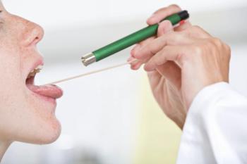 Doctor checking patient's throat