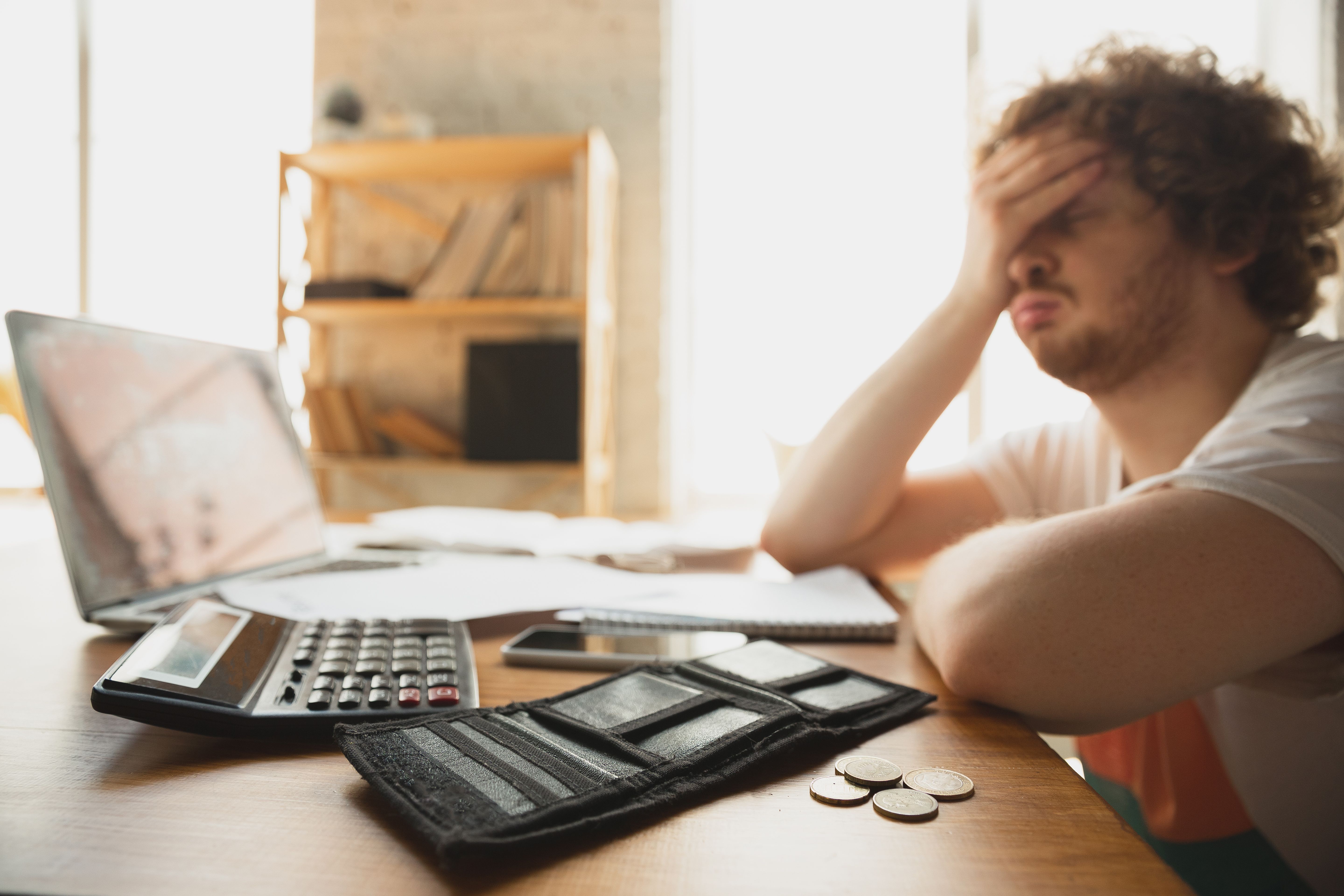 Young man frustrated with finances | Image credit: master1305 – stock.adobe.com