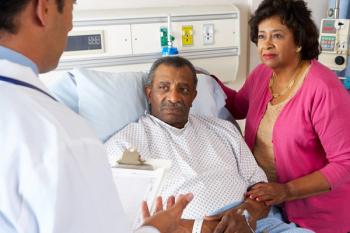 A Black couple listens to a health care provider