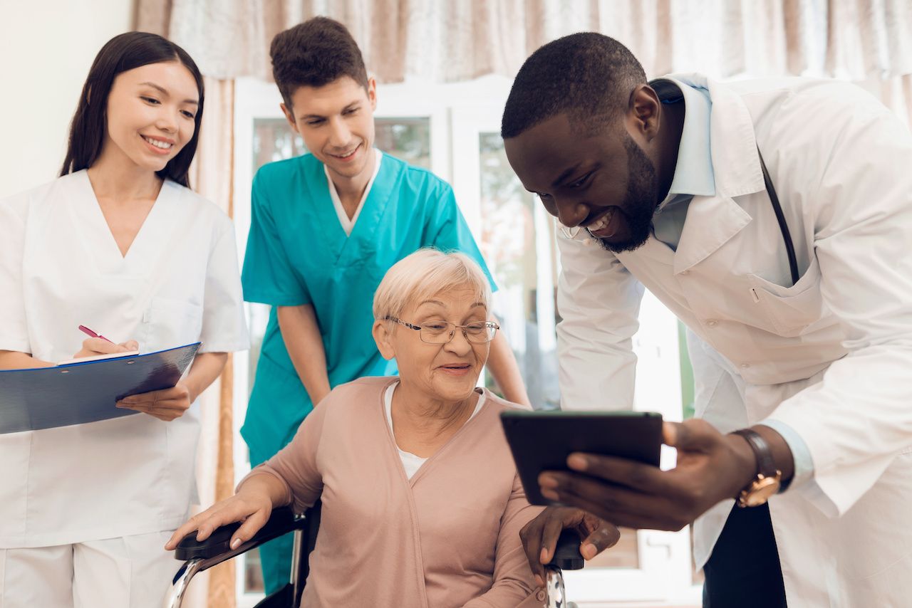 Care team talking with patient: VadimGuzhva - stock.adobe.com