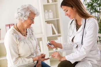 doctor administering diabetes blood test