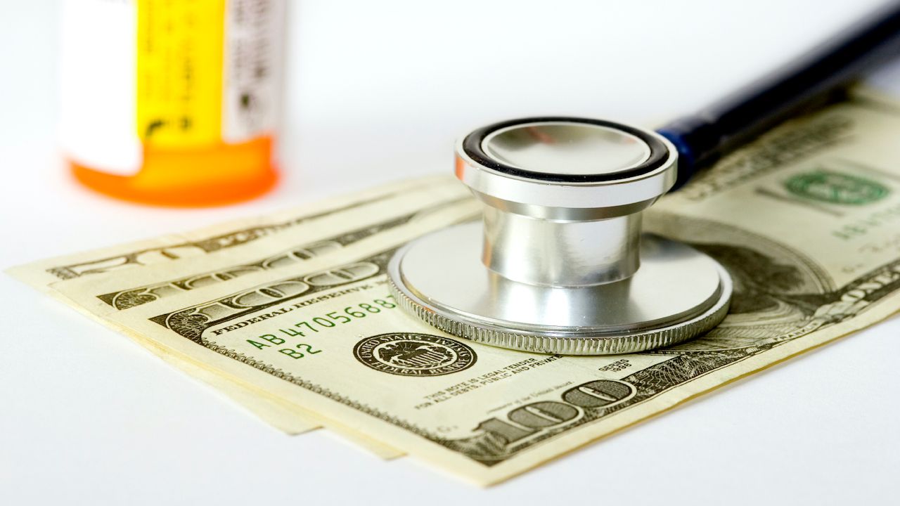 image of stethoscope on bills