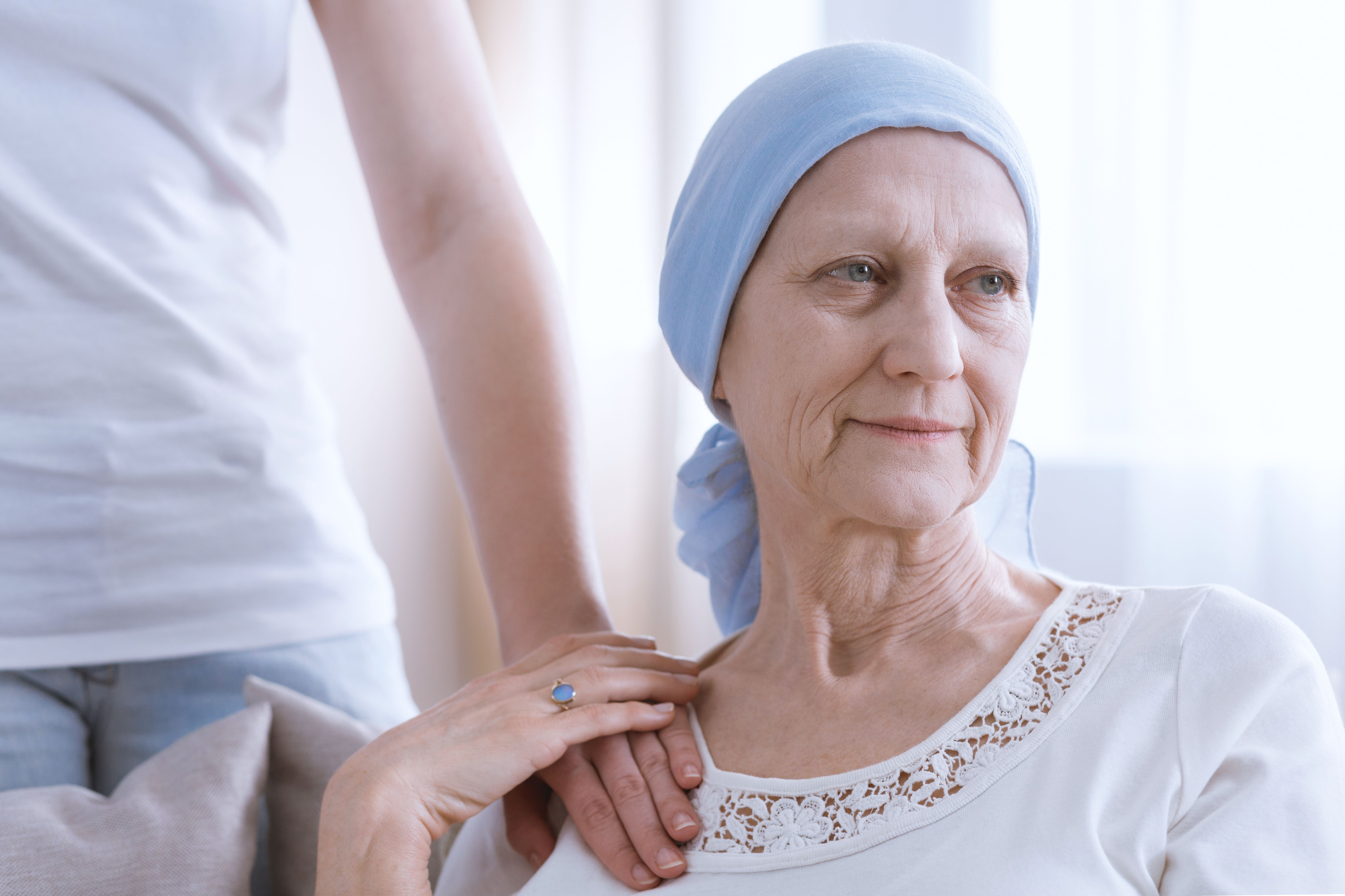 Patient with lung cancer wearing head scarf | Image credit: Photographee.eu – stock.adobe.com