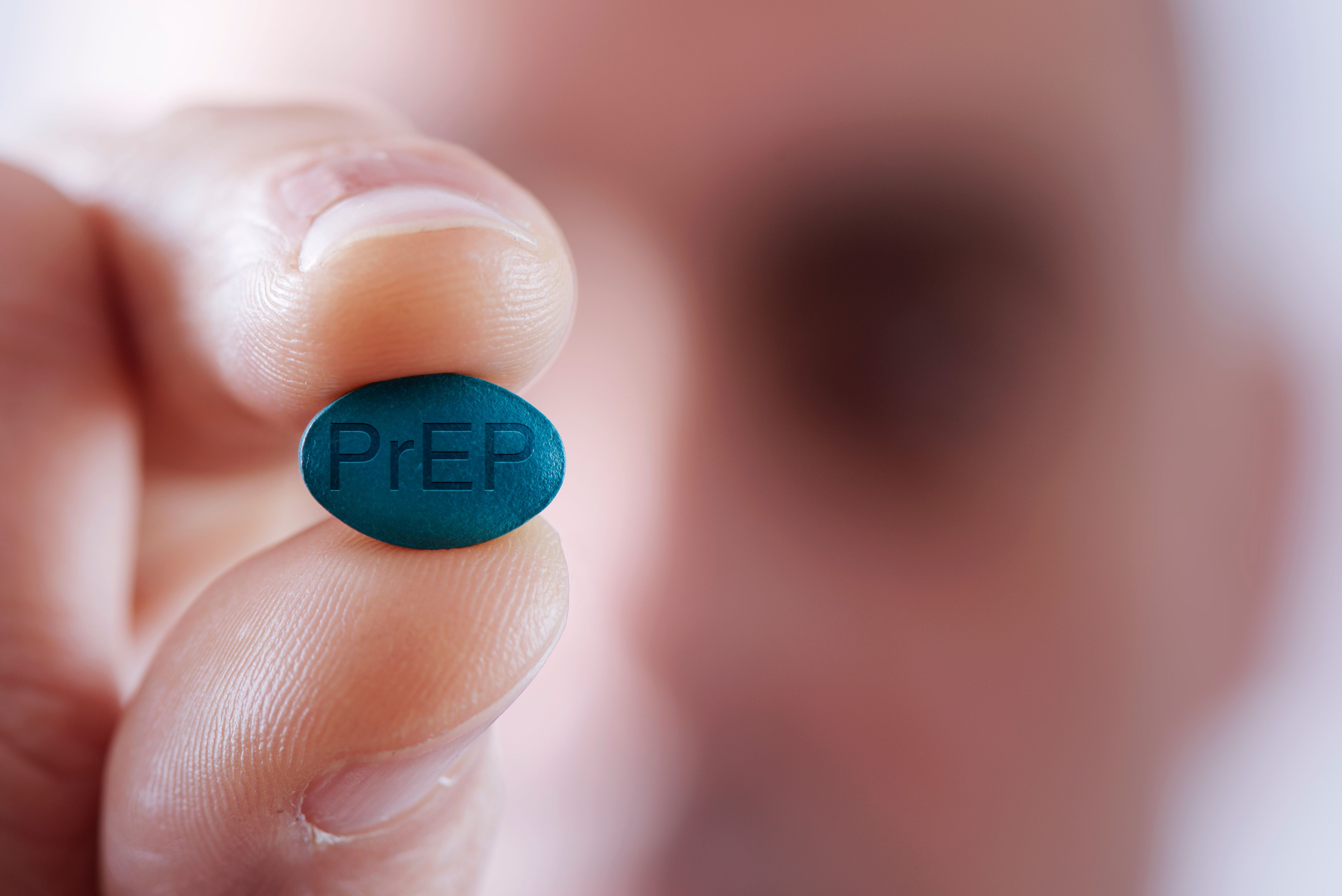 young man with a PrEP pill | Image Credit: nito – stock.adobe.com