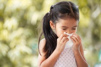 Child with allergies outside with a tissue | Image credit: pingpao - stock.adobe.com