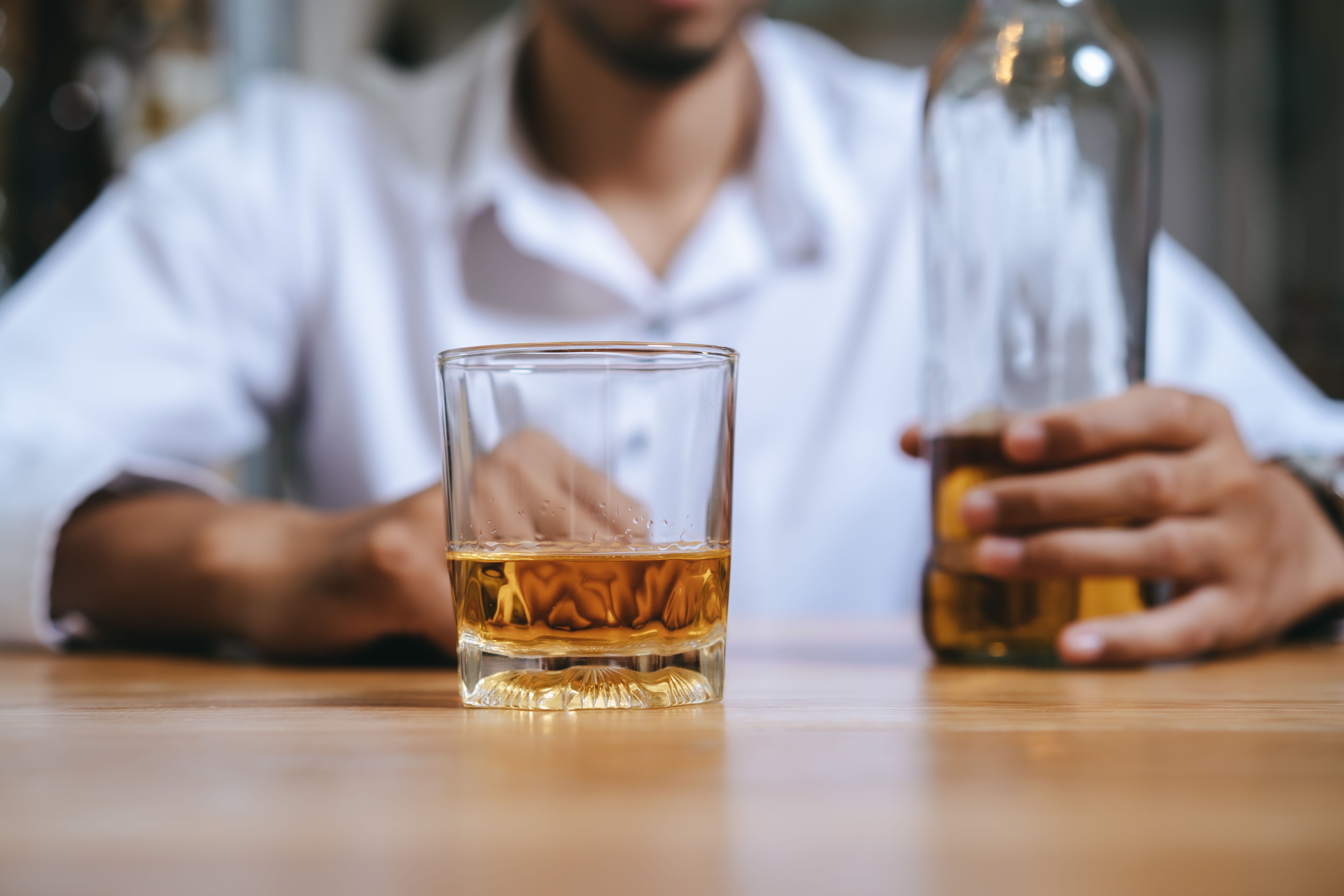 Alcoholism concept | Image Credit: Pormezz - stock.adobe.com