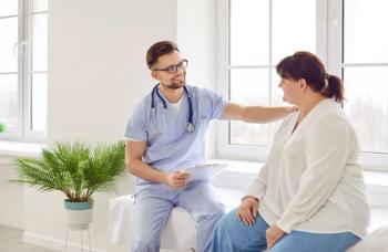 Doctor speaking to a female patient with obesity | Image credit: Studio Romantic - stock.adobe.com