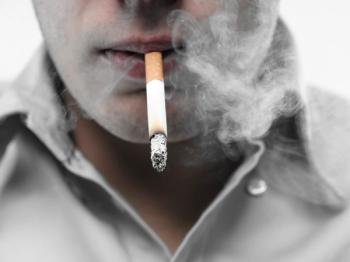 man smoking a cigarette
