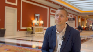 Casey Koch, PharmD, sitting for a video interview