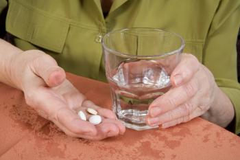 Tablets(old-hands)_iStock_000002793649Small