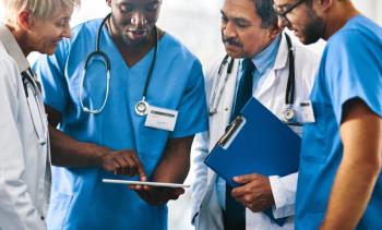 doctors at conference | Image credit: DelmaineDonson - stock.adobe.com