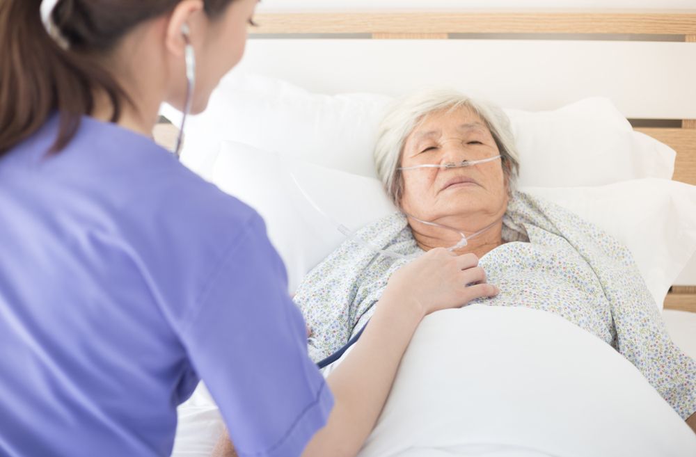 Woman in hospital bed