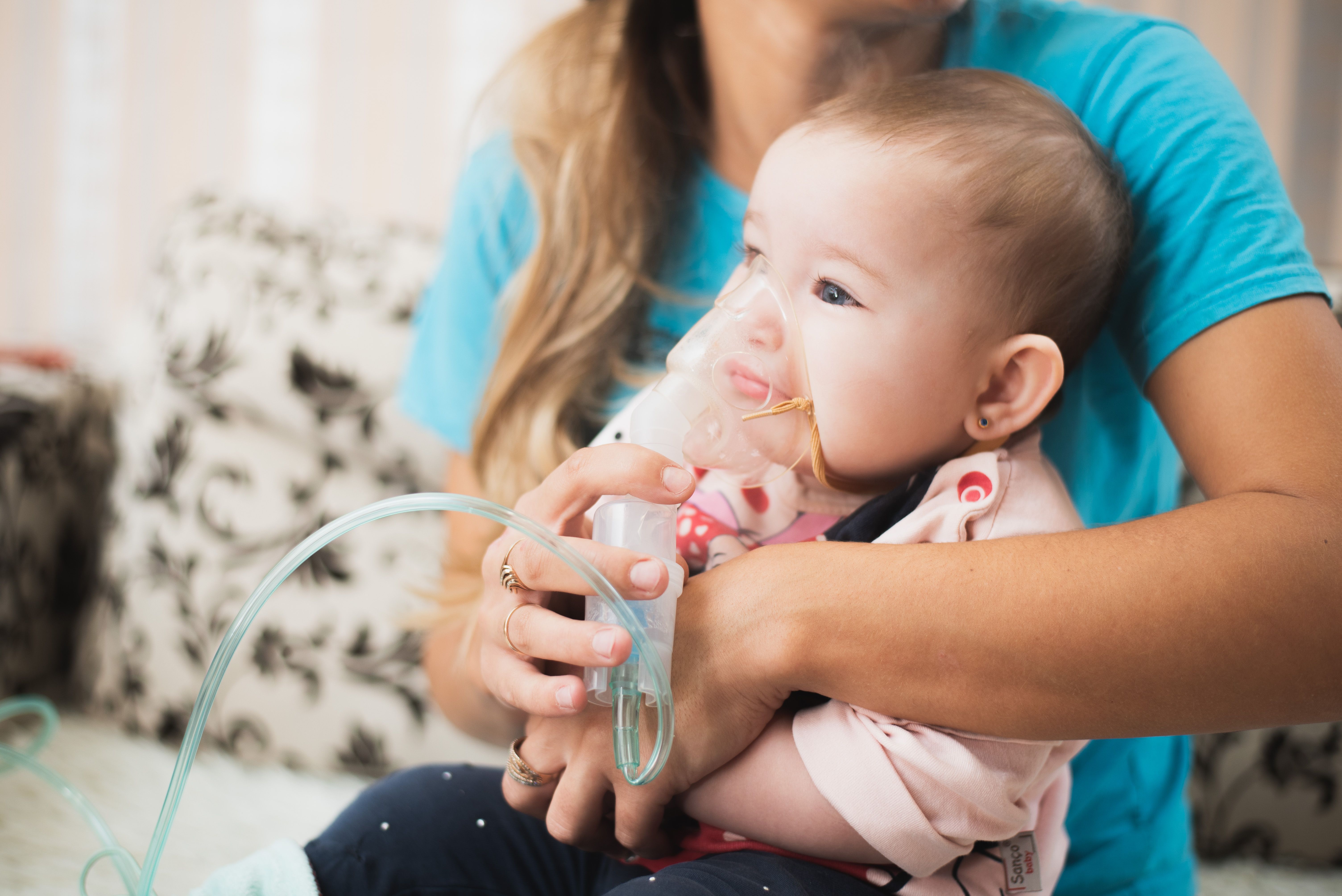 Mom makes inhalation of the child, holding hands | Image credit: komokvm - stock.adobe.com