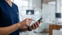 Medical Professional Using Advanced Healthcare Technology Interface on a Smartphone for Patient Data Analysis in a Modern Clinical Setting | Image credit: FahVecStudio - stock.adobe.com
