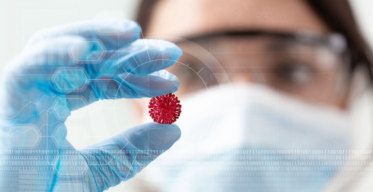 woman scientist holding a coronavirus in a research lab: ©  Paulista - stock.adobe.com