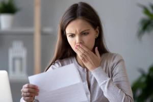 Woman shocked at bill | Image credit: Fzkes for iStock