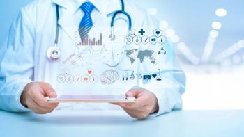 Medical data analytics floating above a device held by a doctor | Image credit: tonefotografia - stock.adobe.com