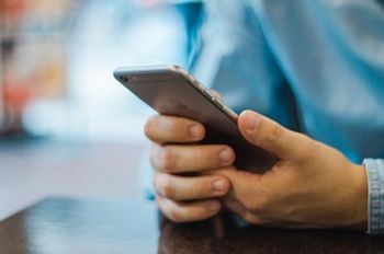 a man holds a smartphone