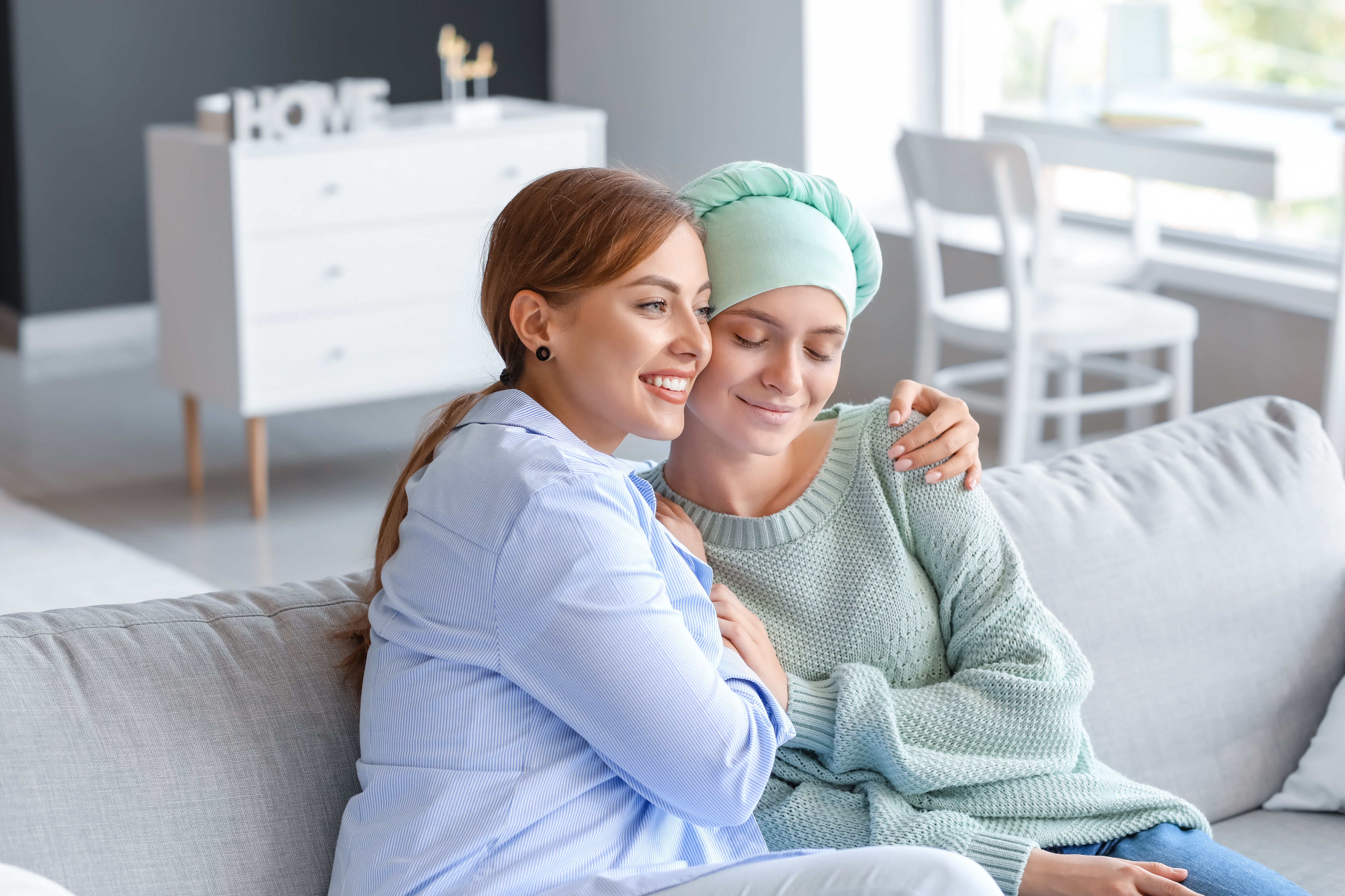 Woman hugging sister with cancer | Image Credit: Pixel-Shot - stock.adobe.com