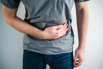 man holding stomach 