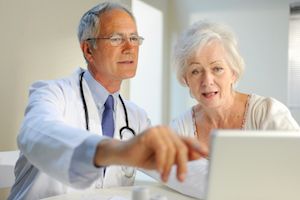 elderly patient with doctor