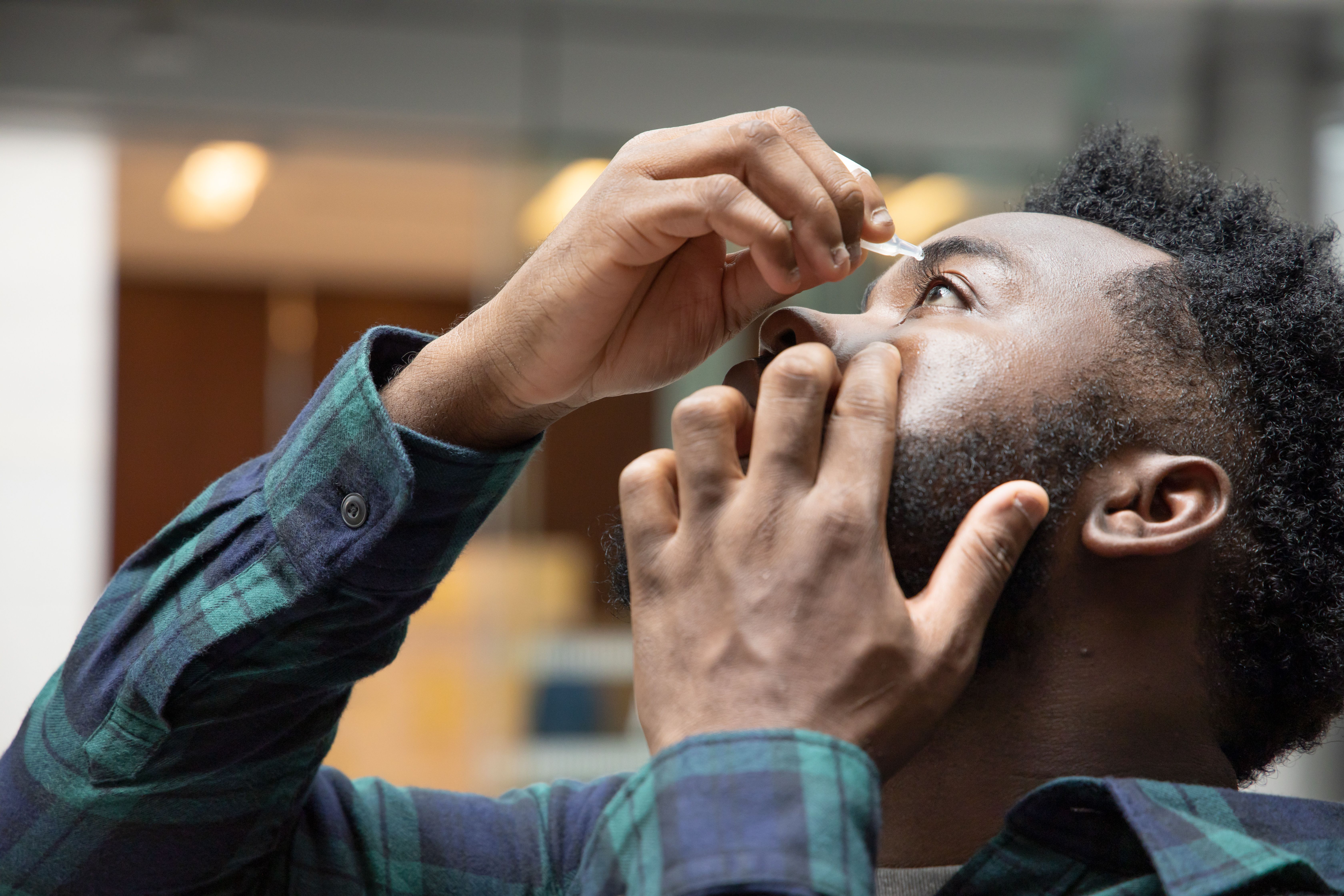Man using eye drops | Image credit: 9nong - stock.adobe.com