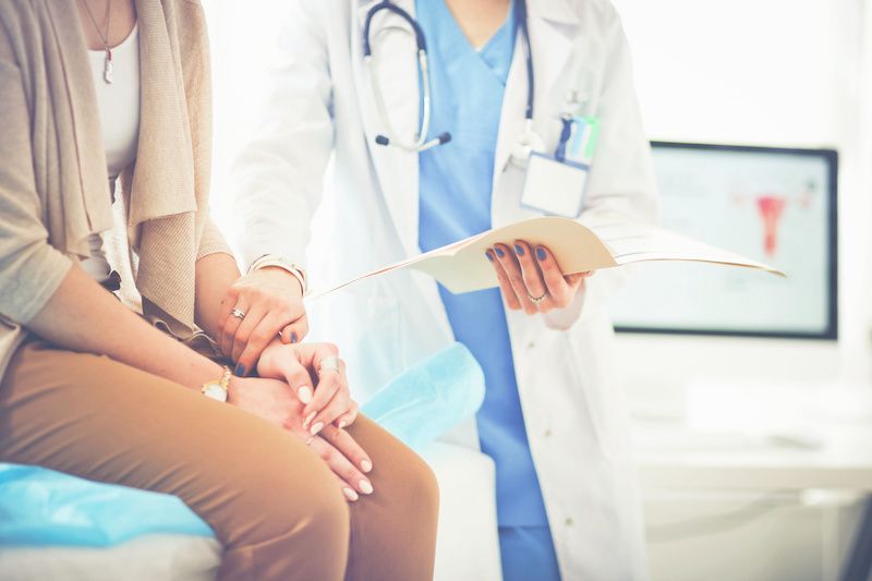 Image of a doctor helping a patient