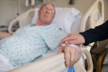 Holding hands with an elderly patient