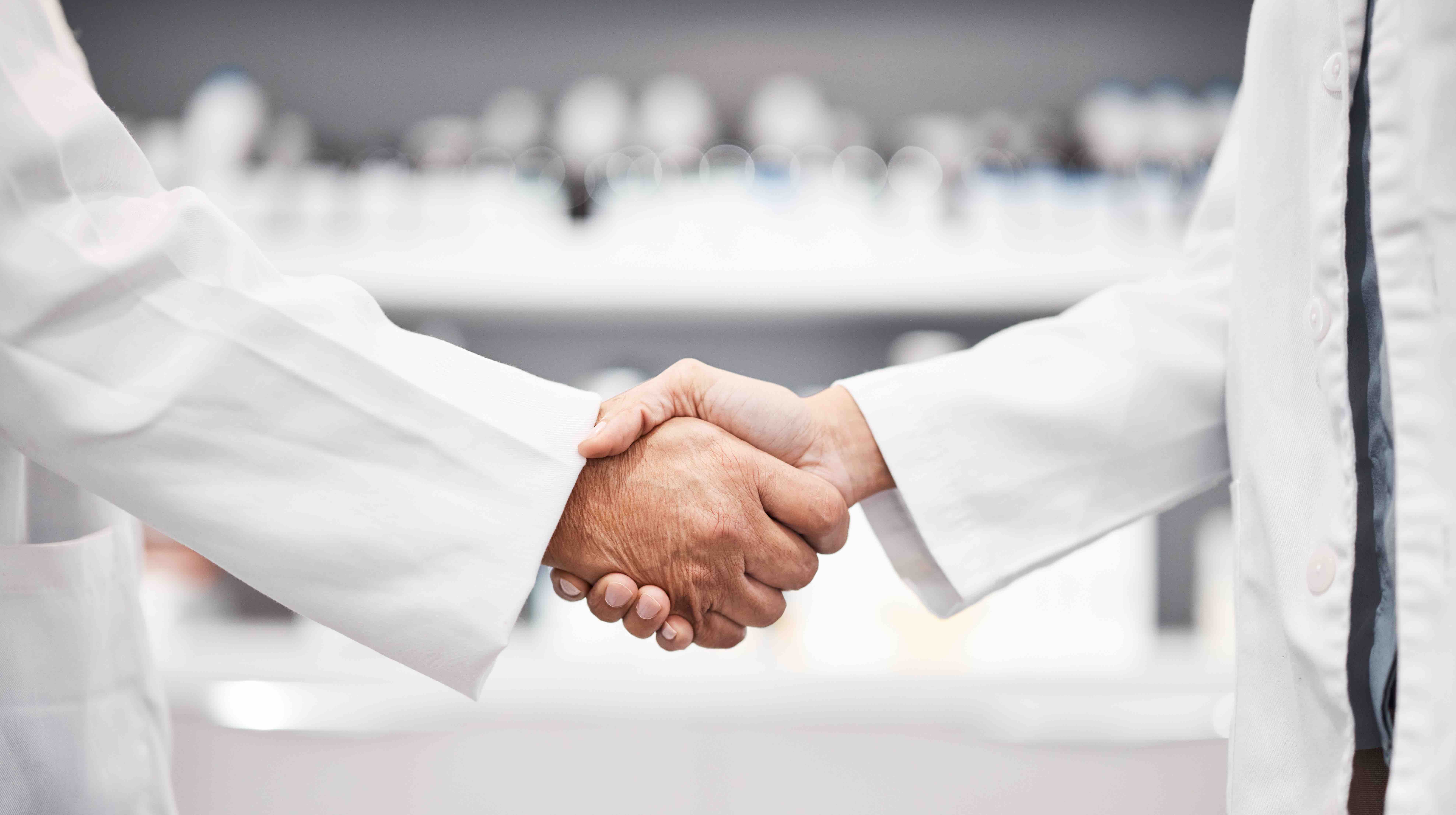Doctors shaking hands | Image credit: Malik E/peopleimages.com - stock.adobe.com