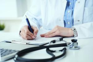 Doctor Writing on Prescription Pad | image credit: cameravit - stock.adobe.com