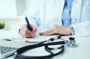 Doctor Writing on Prescription Pad | image credit: cameravit - stock.adobe.com