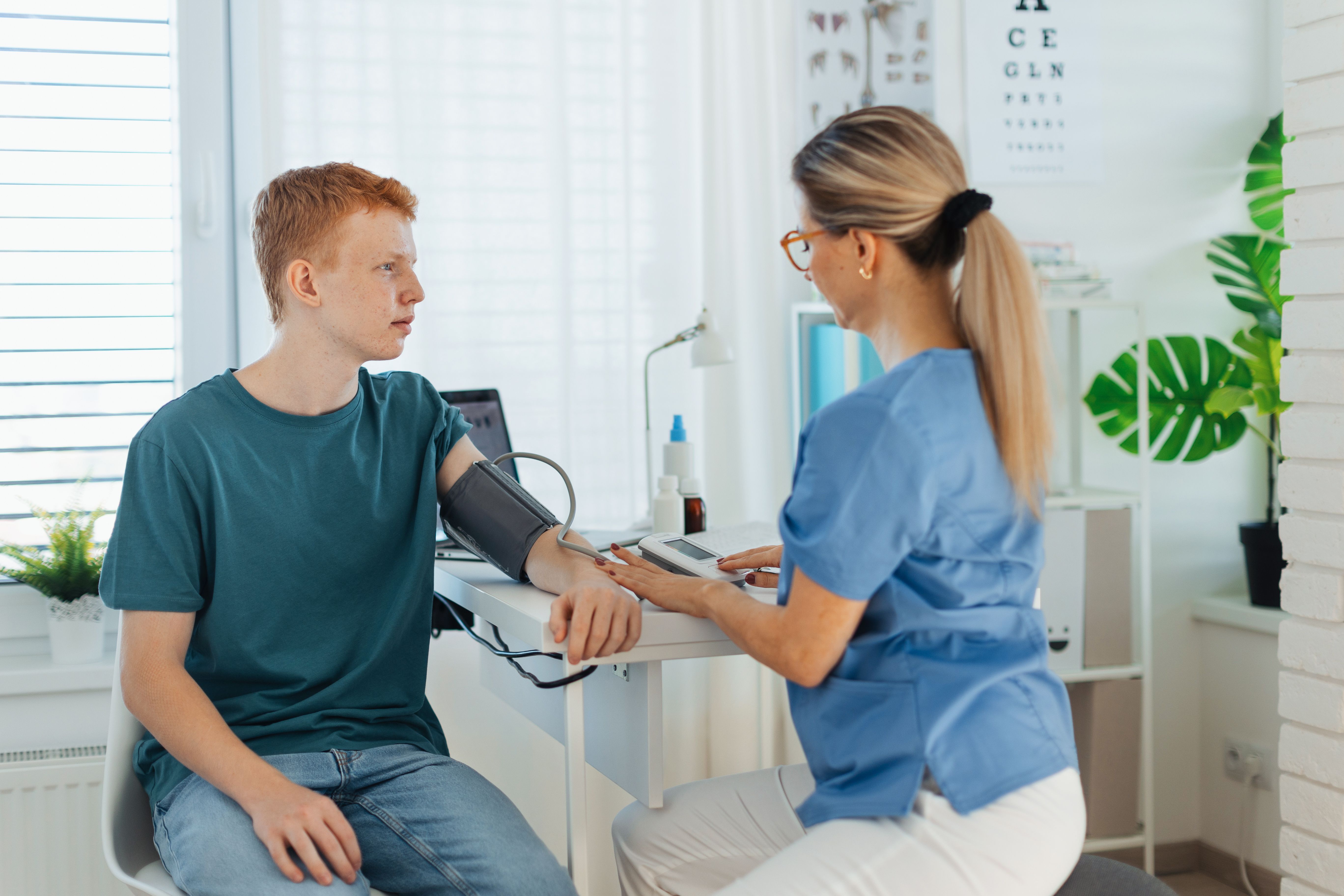 Teenage boy getting blood pressure checked | Image Credit: Halfpoint - stock.adobe.com