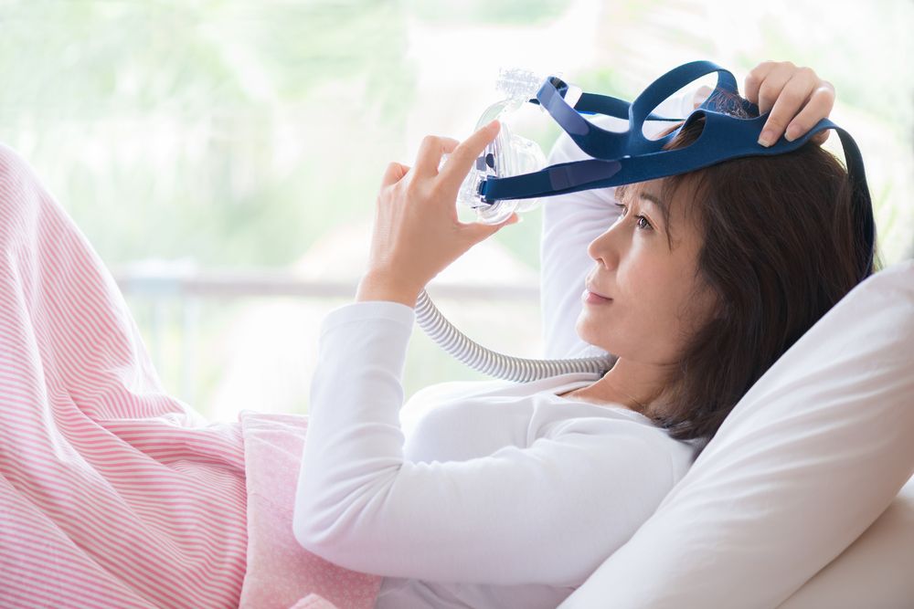 Woman using C-Pap machine