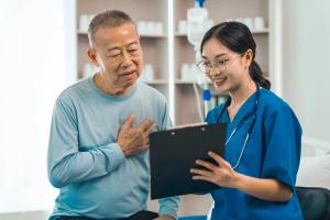 Asian elderly patient speaks with doctor | Image credit:  M+Isolation+Photo - stock.adobe.com