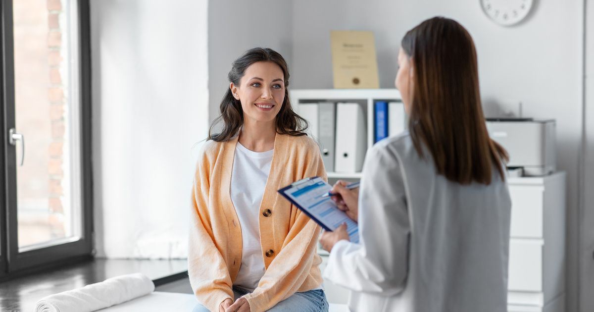 female doctor talking to female patient | Image credit: Syda Productions - stock.adobe.com.