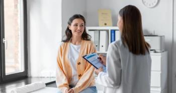 female doctor talking to female patient | Image credit: Syda Productions - stock.adobe.com.