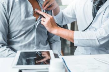 Doctor using stethoscope on patient's heart | Image credit: joyfotoliakid – stock.adobe.com