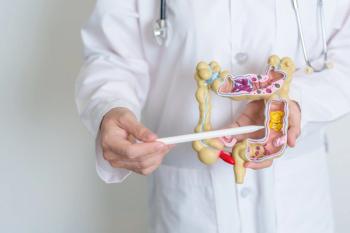 Doctor holding intestines diagram | Image credit: Jo Panuwat D - stock.adobe.com