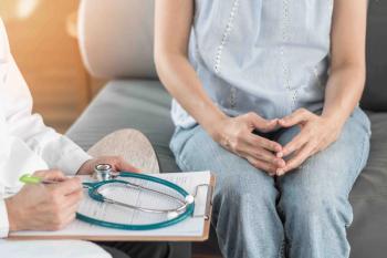 A woman consults with a doctor about myasthenia gravis symptoms. | Image credit: Chinnapong - stock.adobe.com