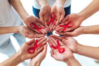 People holding HIV awareness ribbons | Image credit: Vasyl - stock.adobe.com