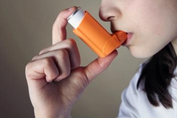 Woman using inhaler