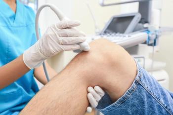 Doctor Conducting Ultrasound | Image credit: Africa Studio – stock.adobe.com