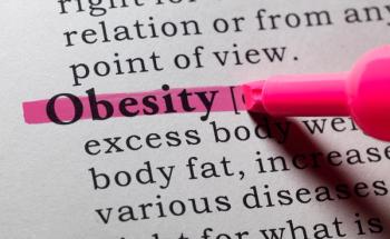 Obesity highlighted on page | Image credit: Feng Yu – stock.adobe.com