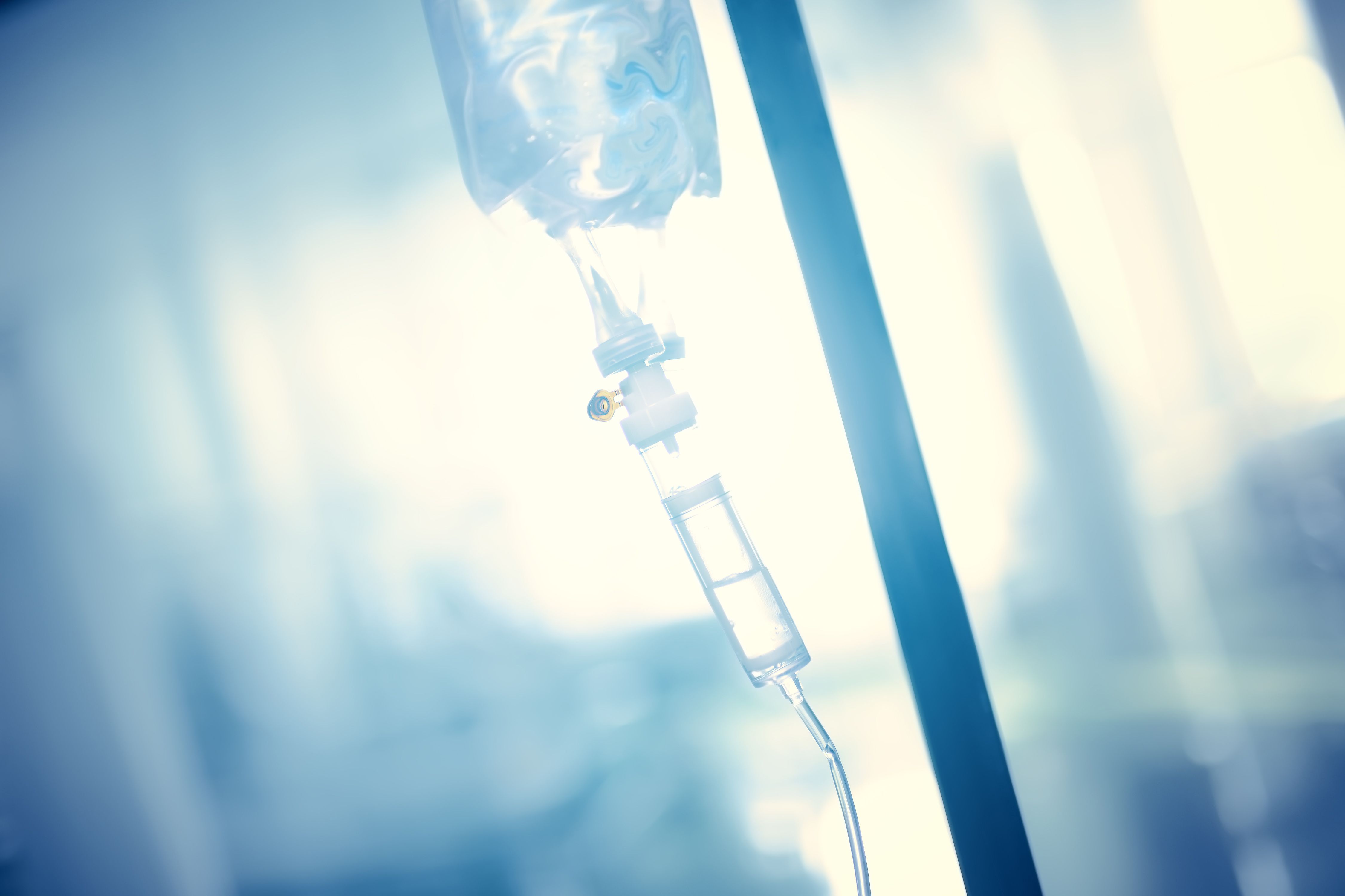 Intravenous drip in the pole against the bright light | Image Credit: sudok1 - stock.adobe.com