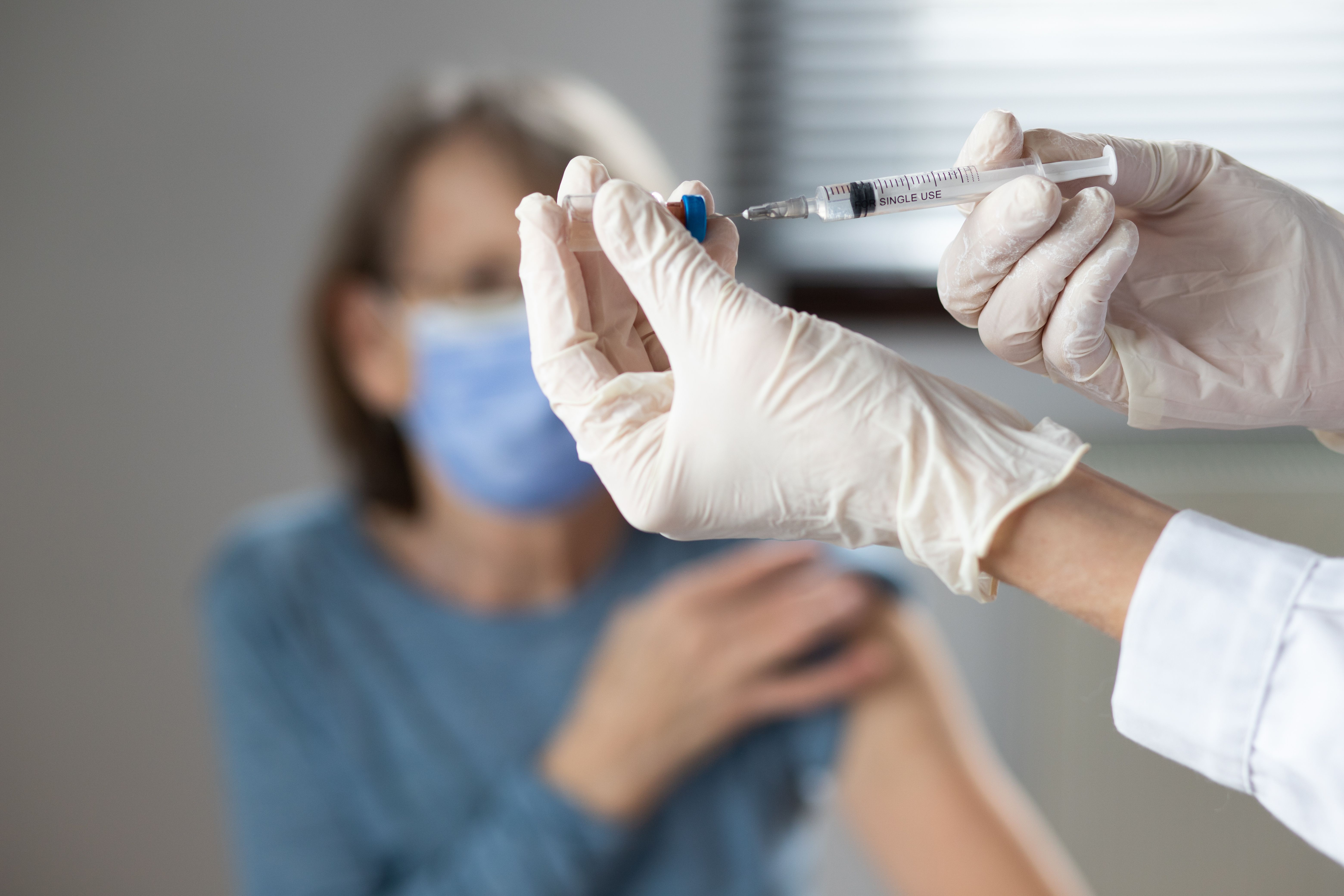 Older woman receiving vaccine | Image credit: Melinda Nagy - stock.adobe.com