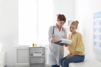 doctor speaking with patient
