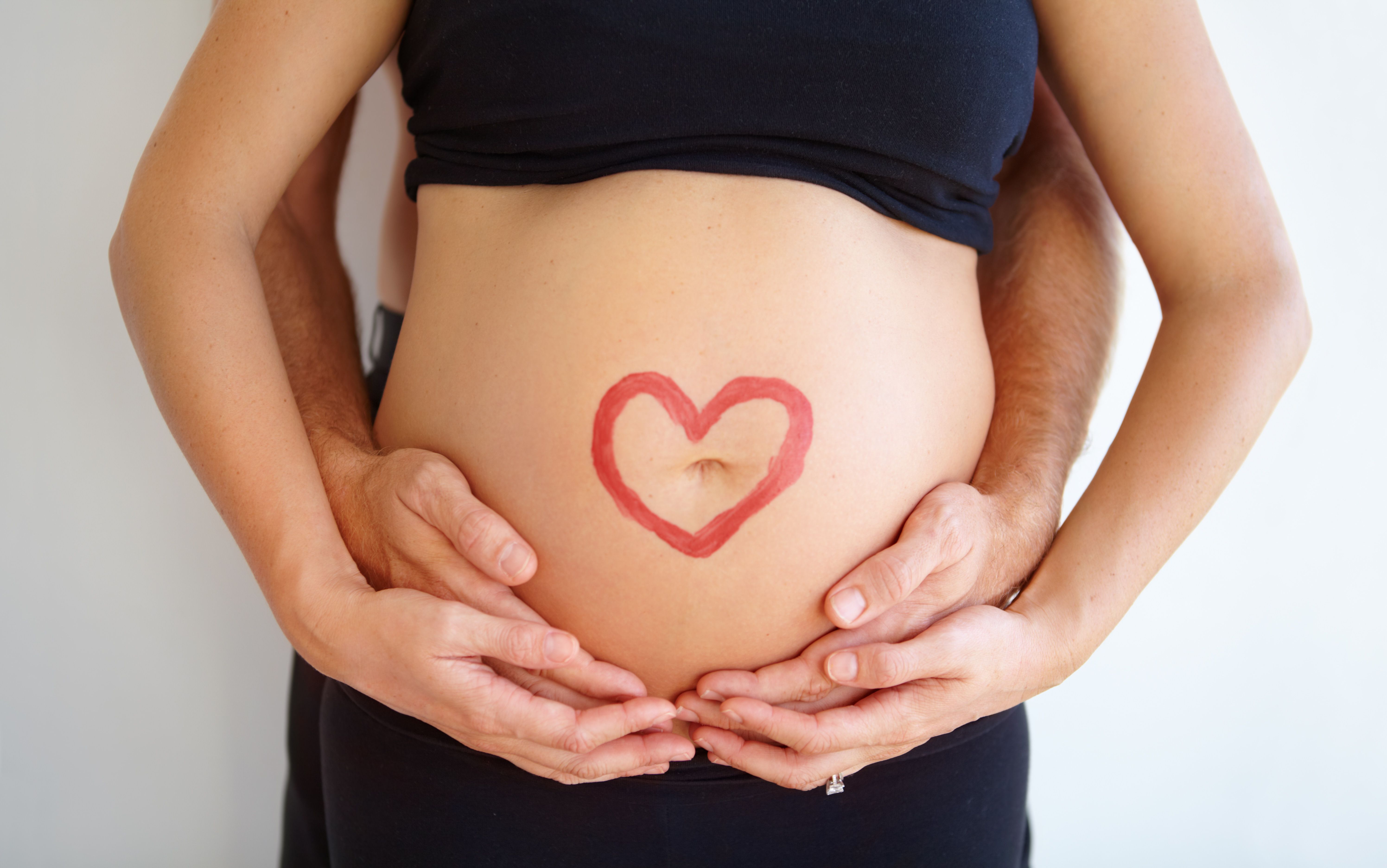 Pregnant stomach. | Image Credit:  Lianne du Toit/peopleimages.com -  stock.adobe.com