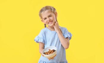Child scratching neck on a yellow background | Image credit: Pixel-Shot - stock.adobe.com